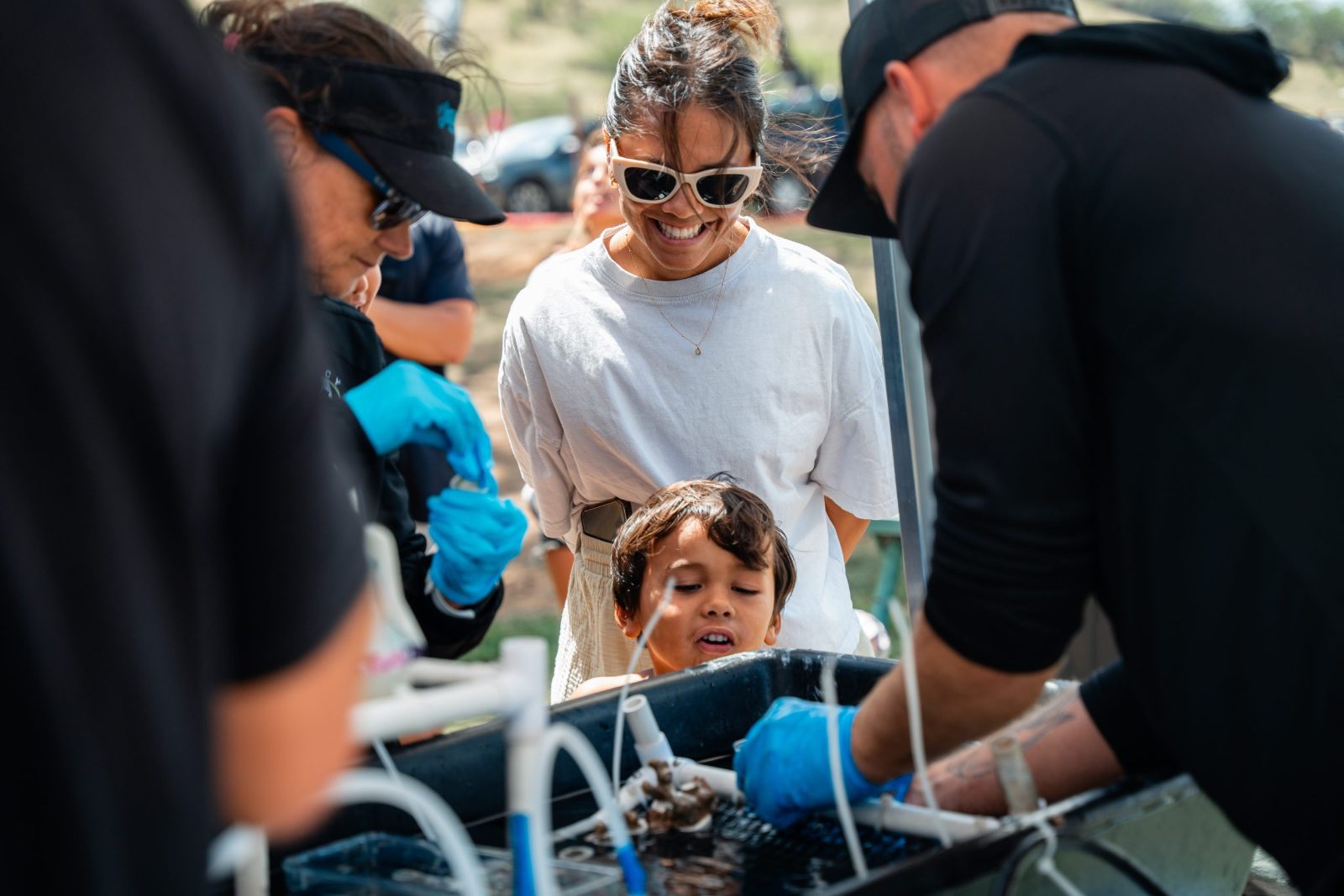 Keiki and families at a coral restoration workshop